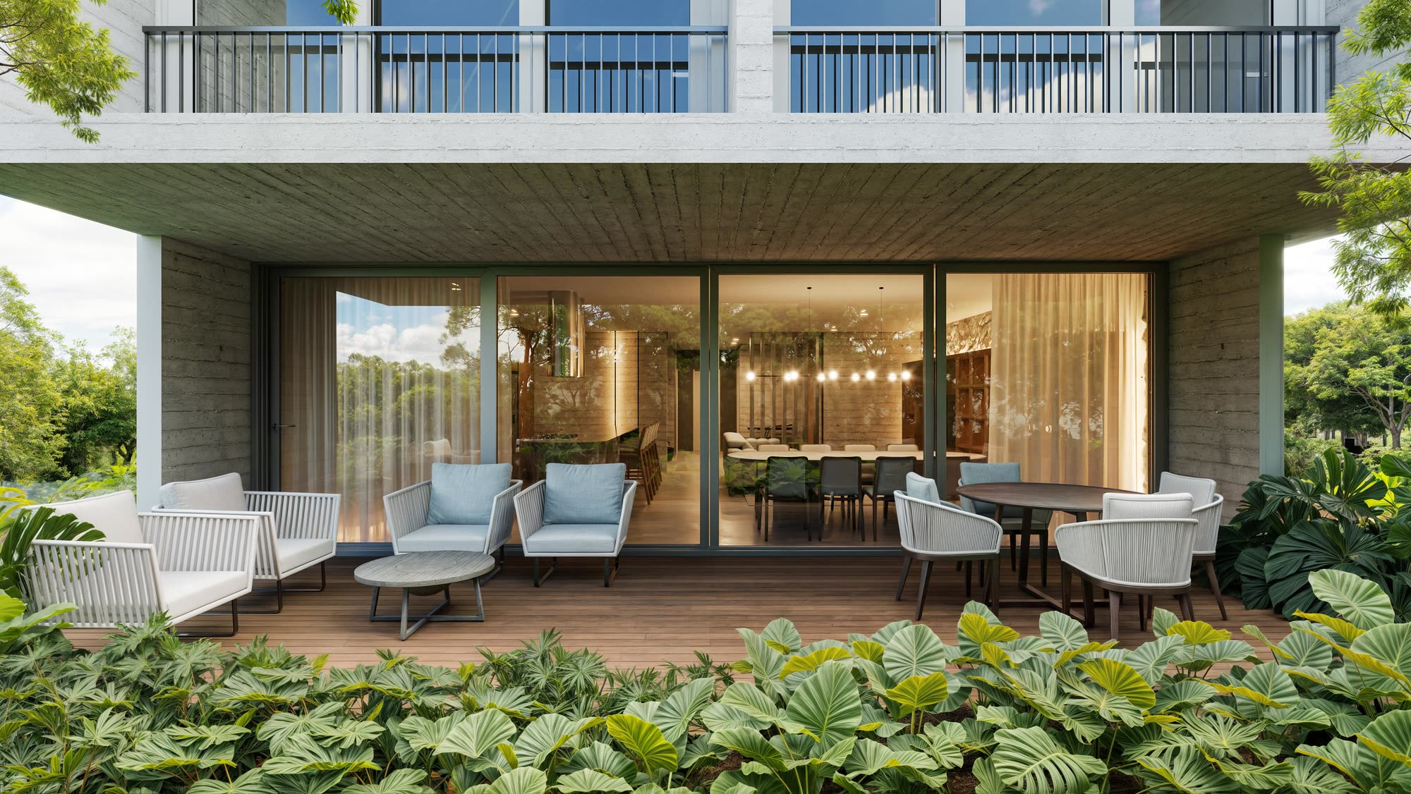 Varanda da Casa Terra sob laje de concreto aparente, cercada de vegetação